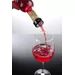 Ball measured pourer